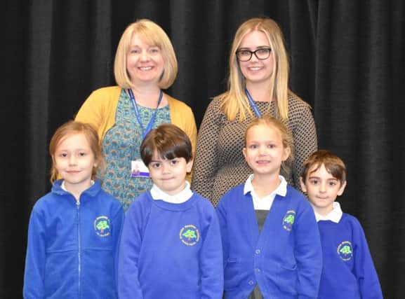 Tracy Fry - Phonics Champion and EYFS teacher ( short blonde hair) and Georgia Barnes - YR 1 teacher. Pupils , from left to right - Julia, Matheus, Evie-Leigh and Daniel.