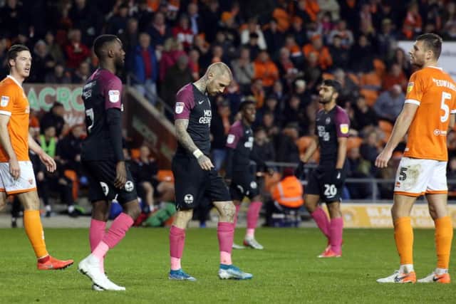 Marcus Maddison of Peterborough United cuts a dejected figure at full-time after a 4-3 defeat at Blackpool. Photo: Joe Dent/theposh.com.