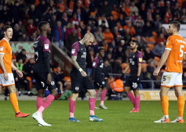 Marcus Maddison of Peterborough United cuts a dejected figure at full-time after a 4-3 defeat at Blackpool. Photo: Joe Dent/theposh.com.