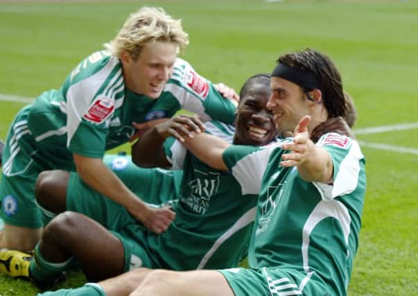 From left, Craig Mackail-Smith, Aaron Mclean and George Boyd will be reunited at Stevenage on Saturday.