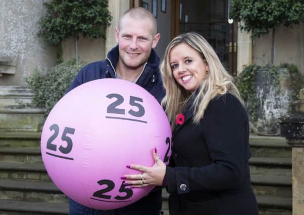 Daniel and Charlotte celebrate 25 years of the lottery