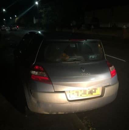 The Renault Megane which police said narrowly missed hitting a police van head-on