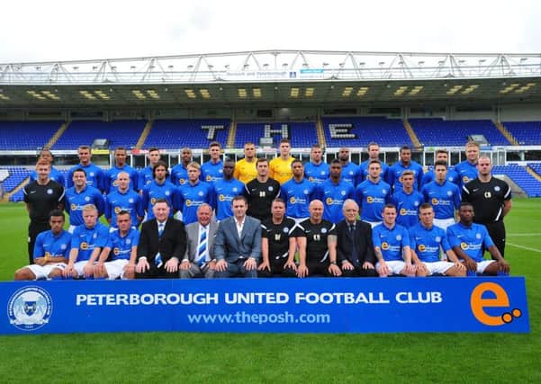 Lord Mawhinney pictured with the Peterborough United squad in a team picture ahead of the  2012-13 season.