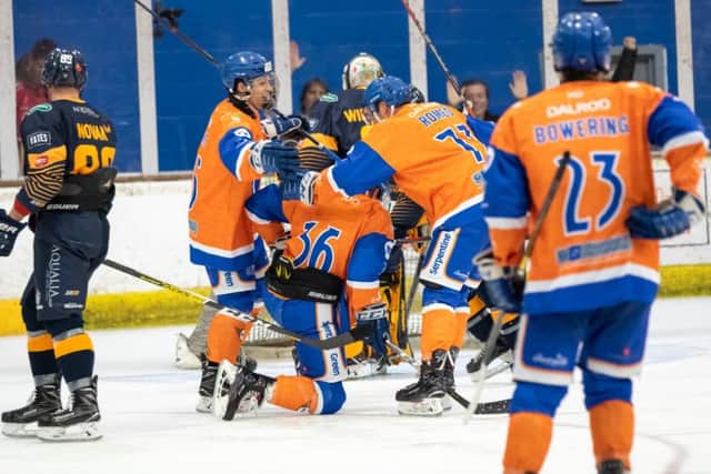 Gareth O'Flaherty (kneeling) is congratulated by team-mates after scoring on his home debut for Phantoms. Photo: Tom Scott.