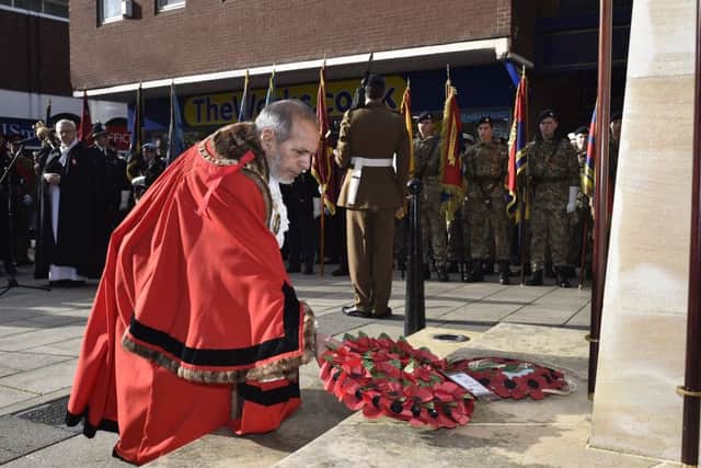 Remembrance Sunday in Peterborough City Centre.  Mayor of Peterborough Coun. Gul Nawaz laying wreath EMN-191011-212815009