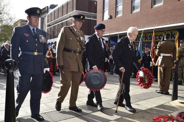 Remembrance Sunday in Peterborough City Centre.  Wreath laying at the memorial EMN-191011-212849009