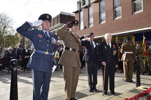 Remembrance Sunday in Peterborough City Centre.  Wreath laying at the memorial EMN-191011-212900009