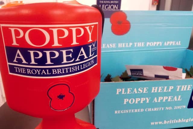 A poppy tin and box similar to the one stolen