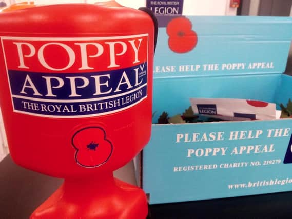 A poppy tin and box similar to the one stolen