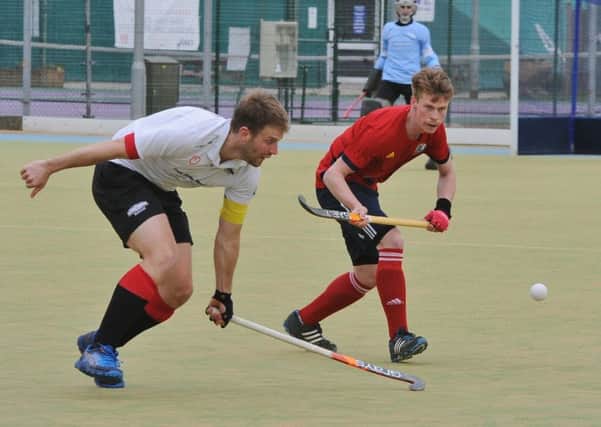 Ross Ambler (red) scored for City of Peterborough against Loughborough Students