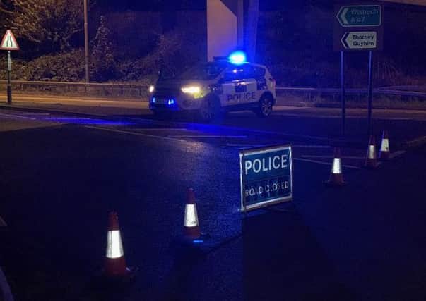 Police at the scene of the road closure. Photo: Cambridgeshire police
