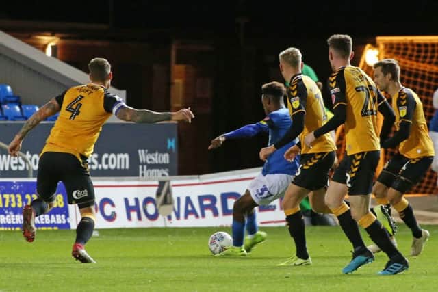 Ricky-Jade Jones of Peterborough United scores his goal against Cambridge United. Photo: Joe Dent/theposh.com.