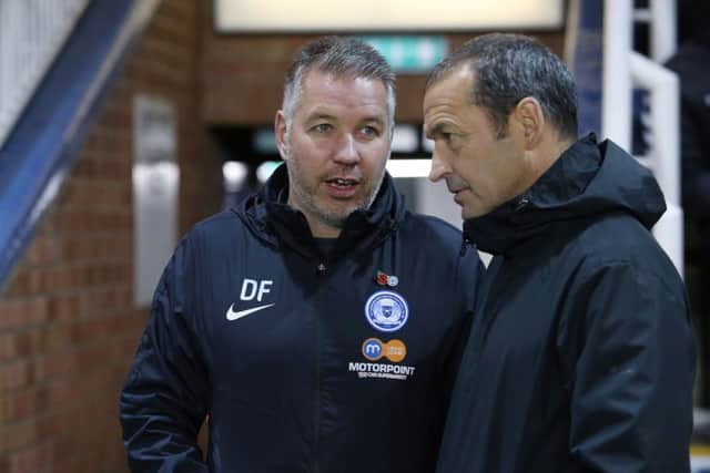 Posh manager Darren Ferguson with Cambridge manager Colin Calderwood before the match. Photo: Joe Dent/theposh.com.