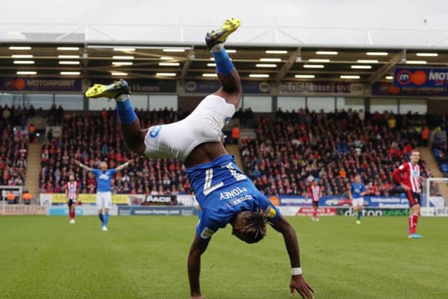 Ivan Toney celebrates a goal for Posh against Lincoln.