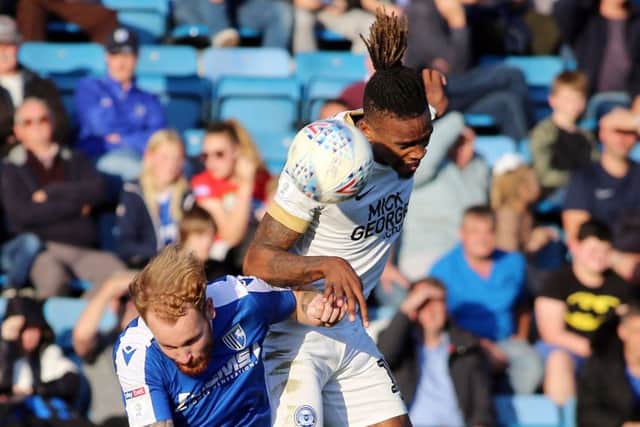 Ivan Toney (white shirt) in action for Posh.