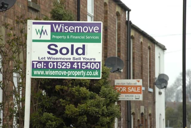 For Sale and Sold signs. EMN-140328-131550001