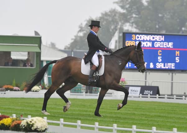 Burghley Horse Trials 2014.  Simon Grieve in the dressage EMN-140409-235532009