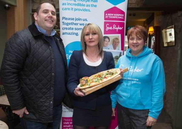 Knead Pubs executive chef Nick Buttress, competition winner Amanda Willson and hospice fundraiser Jo Marriott with the winning pizza. For every pizza sold, £1 will be donated to the Thorpe Hall Hospice Appeal.