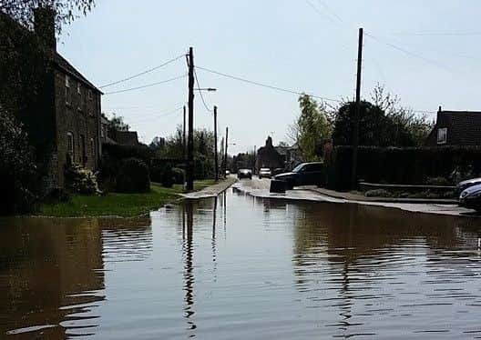 Flooding in King Street, West Deeping, after a water main burst. Photo: Alison Ireland. EMN-150423-112221001