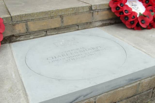 A commemorative stone for First World War soldier Charles Sharpe at the War Memorial in Bourne.