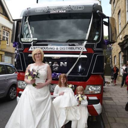 Sarah Farrington, Brett Baines wedding at Stamford register Office. The bride arrived in a Lorry Cab EMN-150905-181106009