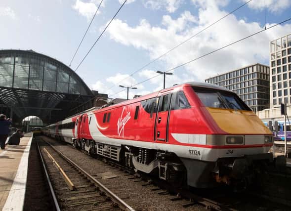 The first Virgin East Coast train at the launch of Virgin Trains East Coast at Londons Kings Cross station. Photo: David Parry/PA Wire EMN-150303-144918001