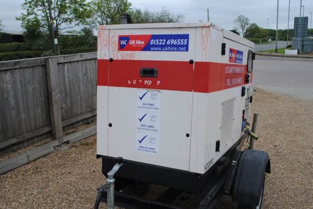This power generator, seized by police officers, is splattered in blood.