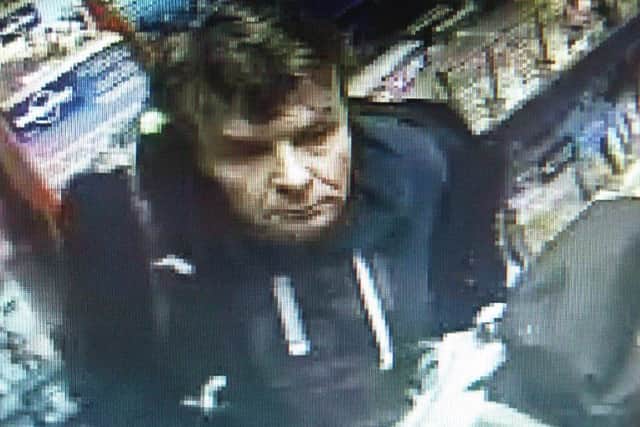 The man police want to speak to about the theft of two magazines from WH Smith in Stamford on May 29, 2015. Incident 303 of May 39. Photo: Lincolnshire Police. EMN-151006-105808001