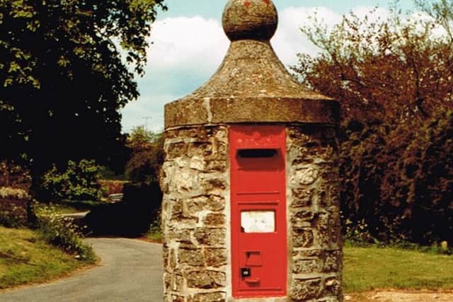 An 1870s pillar mounted wall box as new commitments to preserve the "character and heritage" of the country's post boxes have been set out by Royal Mail and government agency Historic England.
