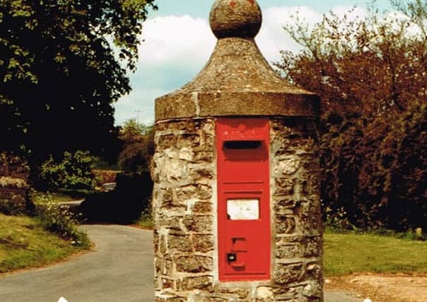 An 1870s pillar mounted wall box as new commitments to preserve the "character and heritage" of the country's post boxes have been set out by Royal Mail and government agency Historic England.