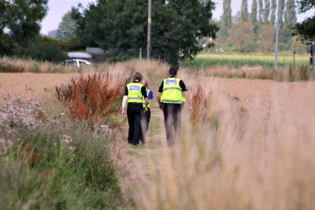 Police were searching fields in the Fleet and Gedney area yesterday (Friday) and  the search goes on today. Photo (TIM WILSON): SG310715-122TW