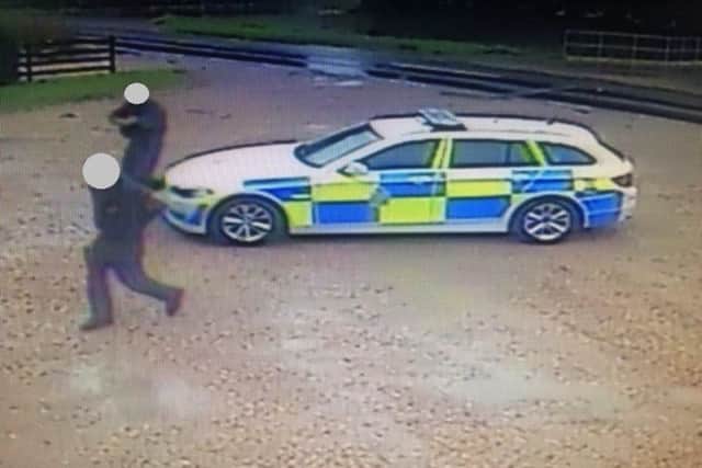 Armed police swoop on a car wash before seizing a toy gun belonging to Eduardo Legavicius (9).