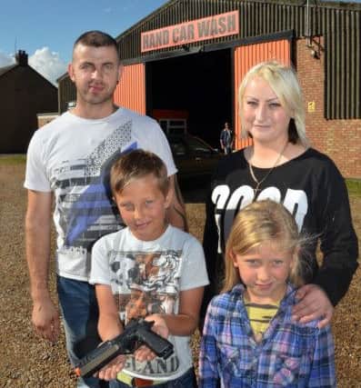 Eduardo Legavicius pictured with his family - dad Marius Legavicius, mum Ernesta Tamutyte, and sister Meda Legavicius at the family car wash. SG0109815-100TW