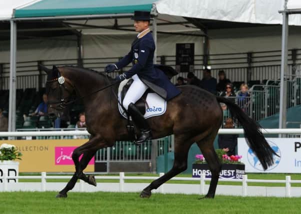 Michael Jung (GER)  riding  FISCHERROCANA FST; during the dressage of The Land Rover Burghley Horse Trials near Stamford in Lincolnshire, UK, on 4th September 2015 EMN-150509-110020001