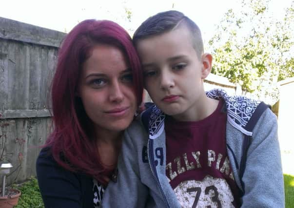 Mum Kym Fountain with autistic son Tyler (11), who still hasn't been found a school place. ANL-150925-142949001