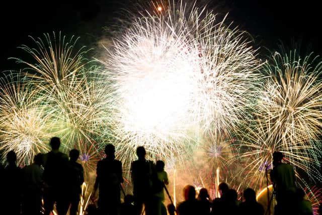 Spectators at a fireworks display - credit Shutterstock
