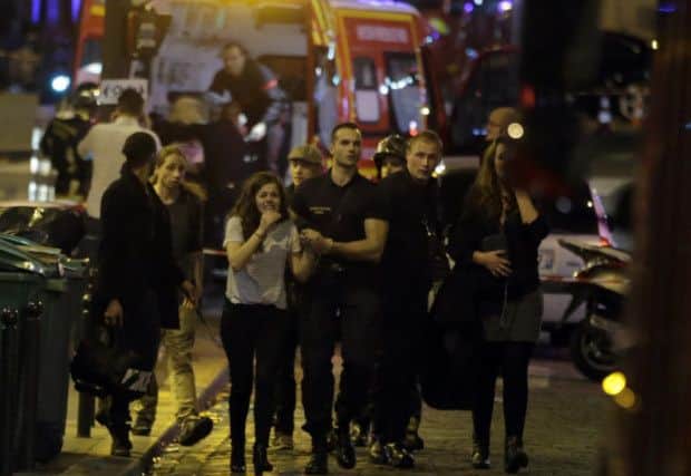 Rescuers evacuate people following an attack in the 10th arrondissement of the French capital. Picture: AFP/Getty Images