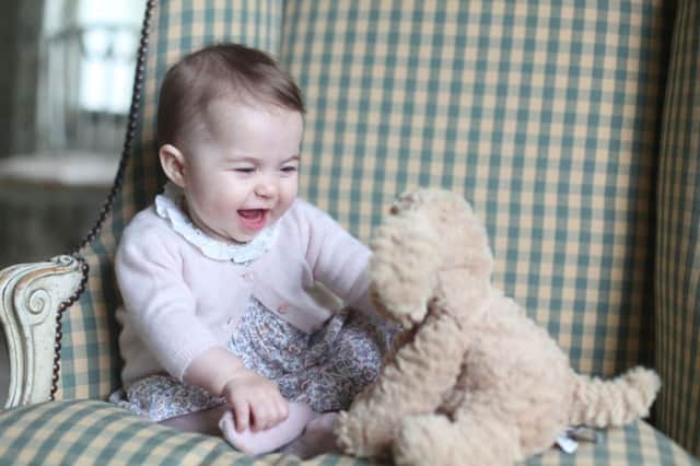 Undated handout photo released by the Duke and Duchess of Cambridge of Princess Charlotte with her cuddly toy dog taken by the Duchess at Anmer Hall in Sandringham earlier this month. PRESS ASSOCIATION Photo. Issue date: Sunday November 29, 2015. See PA story ROYAL Charlotte. Photo credit should read: Duchess of Cambridge ANL-151130-134345001