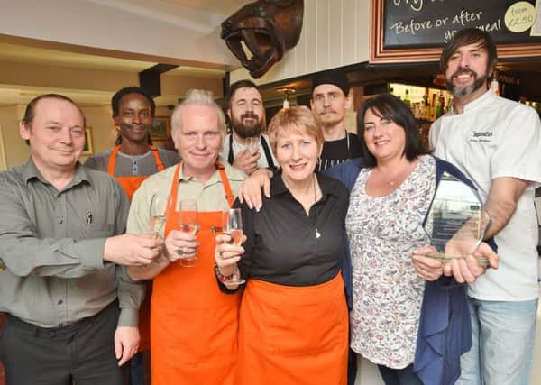 John and Della McGinn with their staff at the Dog-in-a-Doublet pub winners of the PT Pub of the Year EMN-150912-163131009