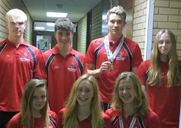 Alex Wray (back second right) and Isobel Spinley (front right) with other members of the Deepings Swimming Club team.