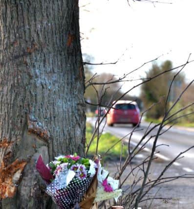 Tributes at the scene of the crash that claimed a man's life. SG100116-TW