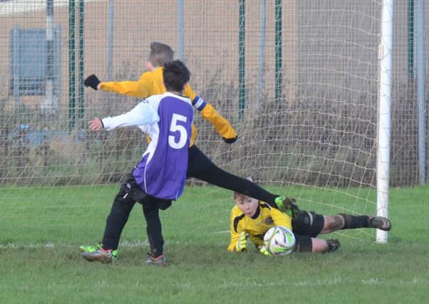 Goalmouth action from the Under 13 game between Crowland and Stanground.