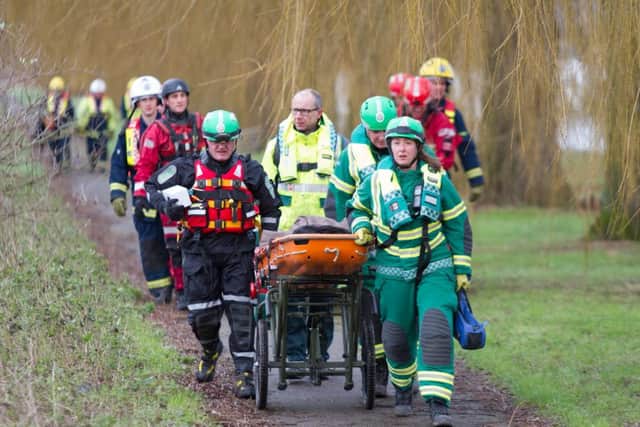 Fire, Ambulance and Paramedics aid a member of the public who is taken ill on their river boat.,
River Nene, Peterborough
14/01/2016. 
Picture by PaperPix/Terry Harris. THA