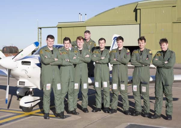 Flying Officers Kit Brash, Louis McQuade, Cam Forster, Oli Barker, Ed Sanderson, George Hobday and Ollie Lee on graduation from RAF Wittering, picyured back row is Squadron Leader Carlos Melen, (one graduate was not available for the picture). Picture by Cpl Paul Robertshaw.