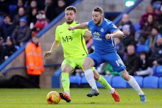 Posh striker Conor Washington tries to get away from Southend defender Luke O'Neill. Photo: Joe Dent/theposh.com.