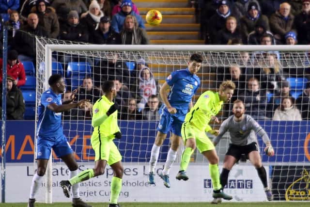Posh centre back Jack Baldwin heads this Southend cross clear. Photo: Joe Dent/theposh.com.