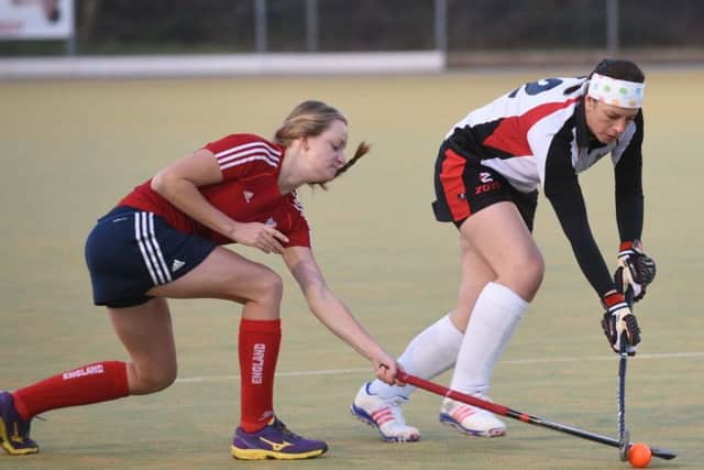 Meg Petherick of City of Peterborough seconds (white) fights for possession with  Jodie Peggs of Wisbech seconds. Photo: David Lowndes.