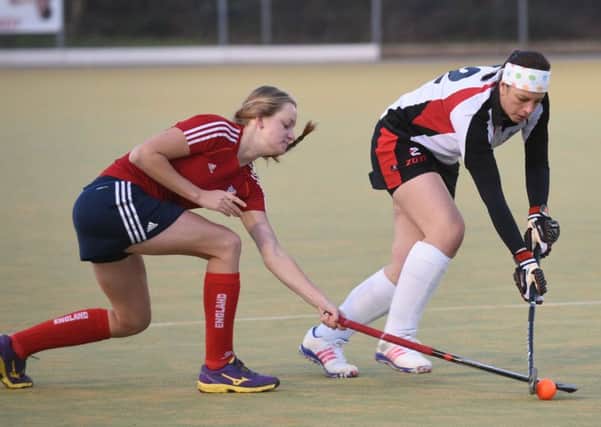 Meg Petherick of City of Peterborough seconds (white) fights for possession with  Jodie Peggs of Wisbech seconds. Photo: David Lowndes.