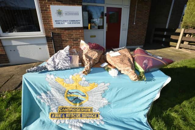 Flowers for Malcolm Bean outside Whittlesey Fire Station