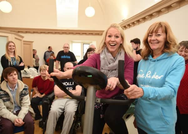 Opening of the new gym at Thorpe hall by Olympic medalists in badminton  Gail Emms. She is pictured with hospice volunteer Kim Elliott EMN-160118-145923009